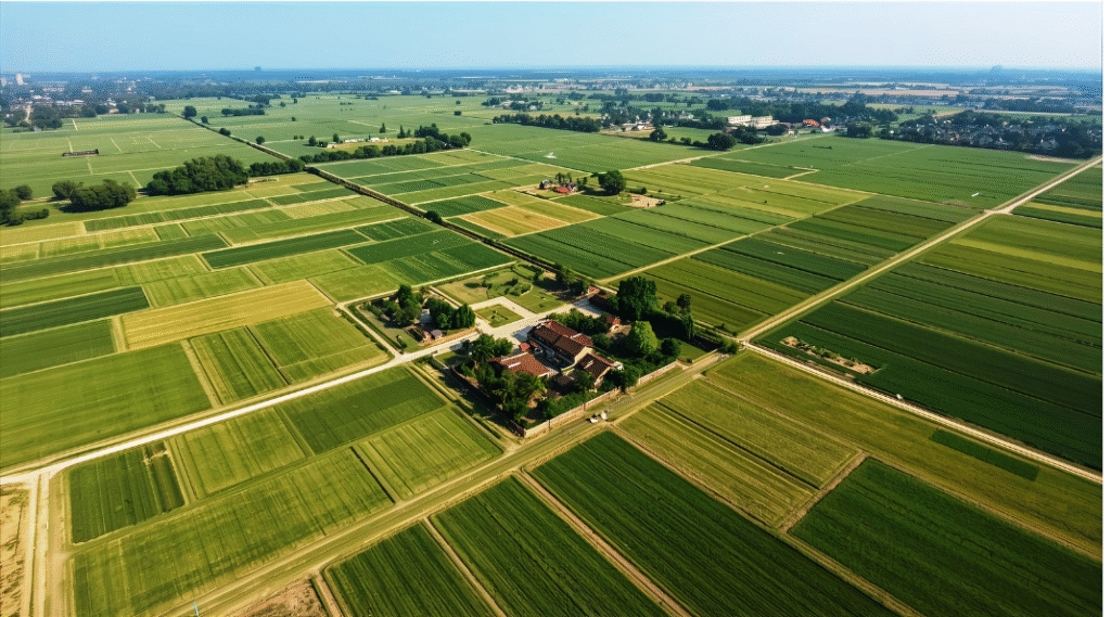 Aerial view of lush green farmland plots near Balaghat city Madhya Pradesh India, clear sky, affordable agricultural land for sale on Nestora.in, HD 1920x1080